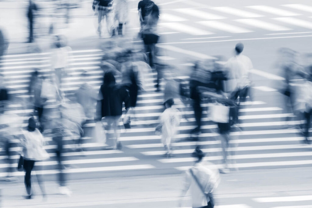 Abstract Motion Blur of People Crossing Busy City Street
