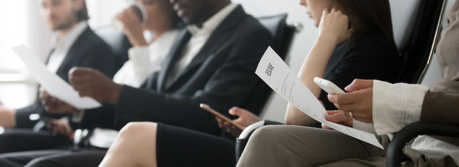 Group of job seekers with a resume
