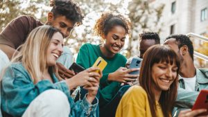 Friends looking at phones together