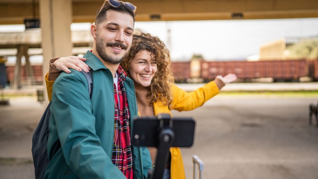 Young couple filming content on their phone