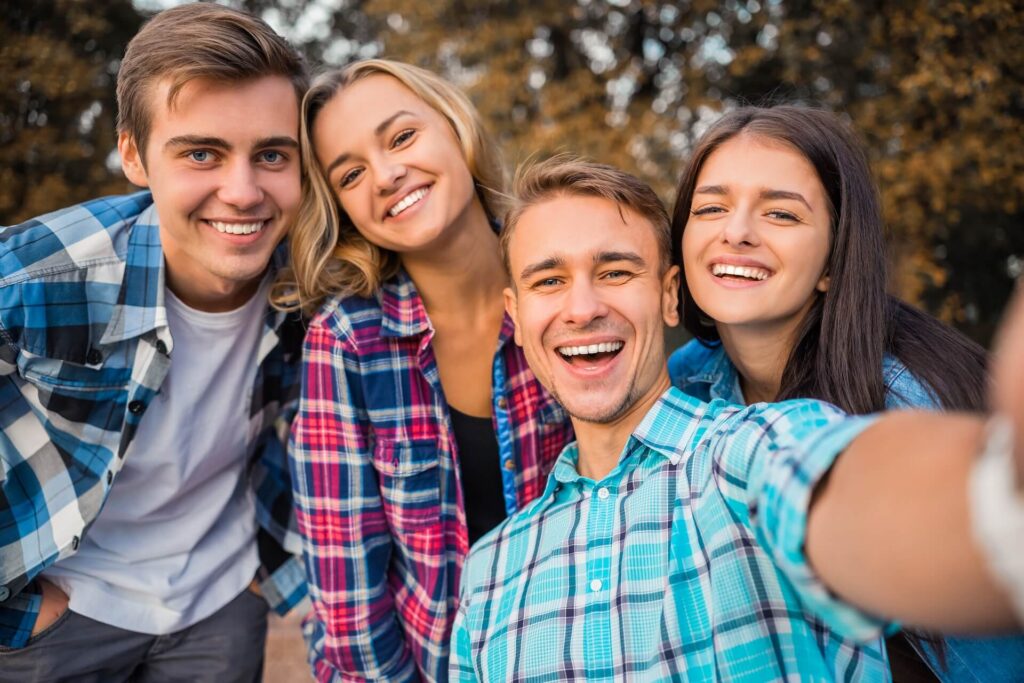 Funny young students, organized a fun time for a walk in the park