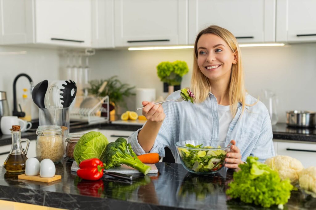 Young girl enjoying low carb diet meal for wellness weight control indoors