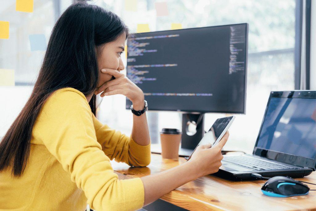 Software engineer looking at computer screen on tokenmaxxing