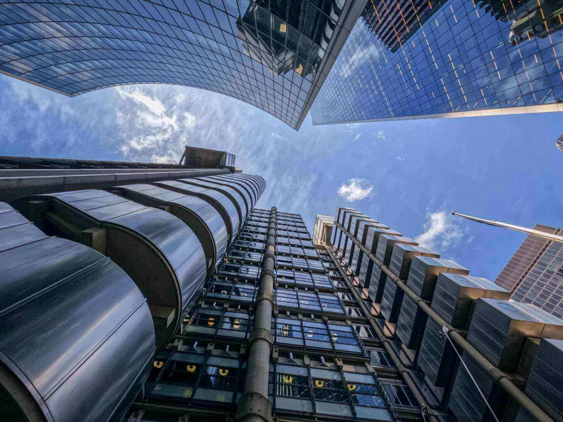 Low-angle view of modern skyscrapers with reflective glass