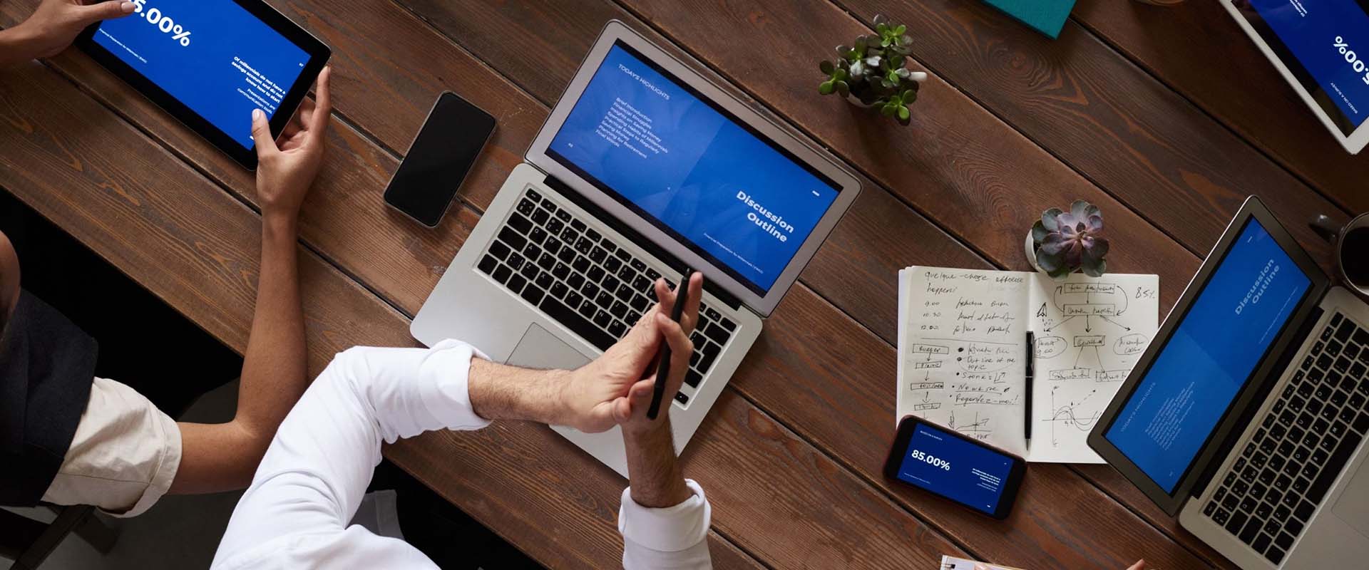 Business meeting with laptop and other connected devices