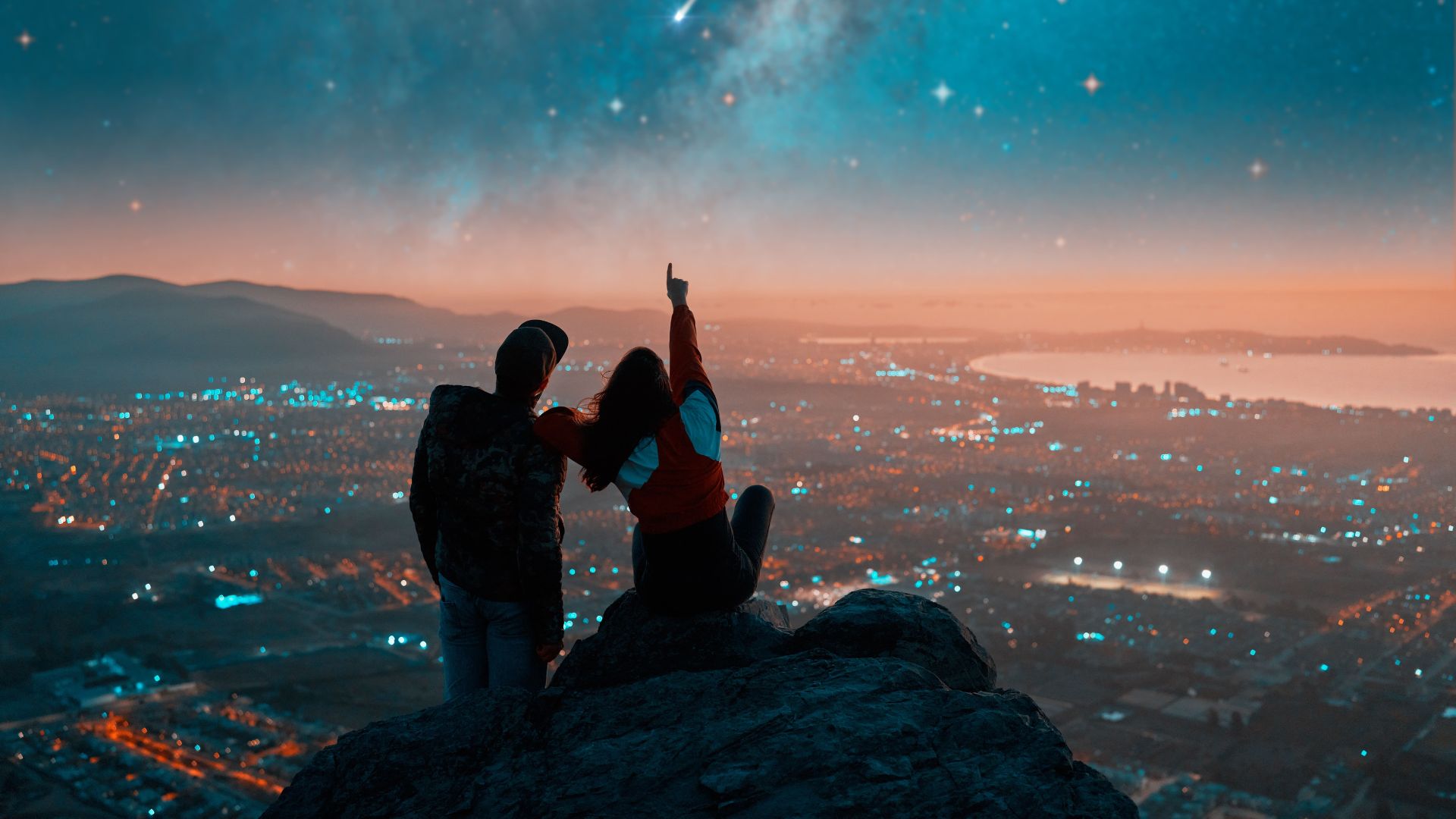 Couple enjoying city view at night