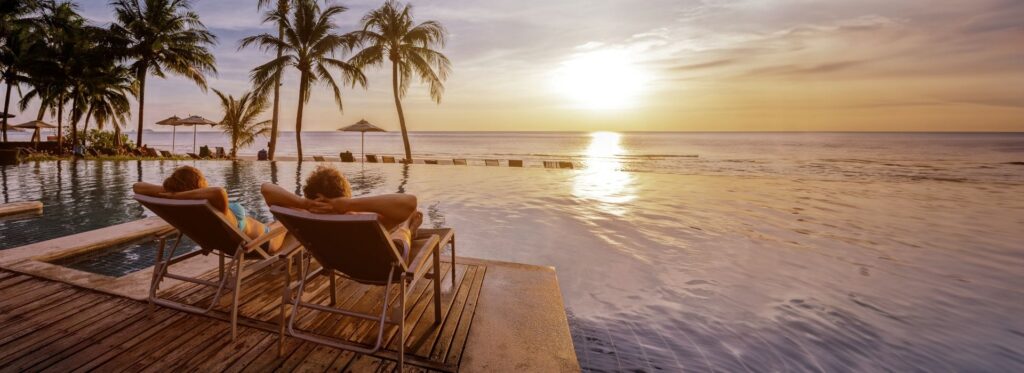 Couple relaxing on holiday next to the water
