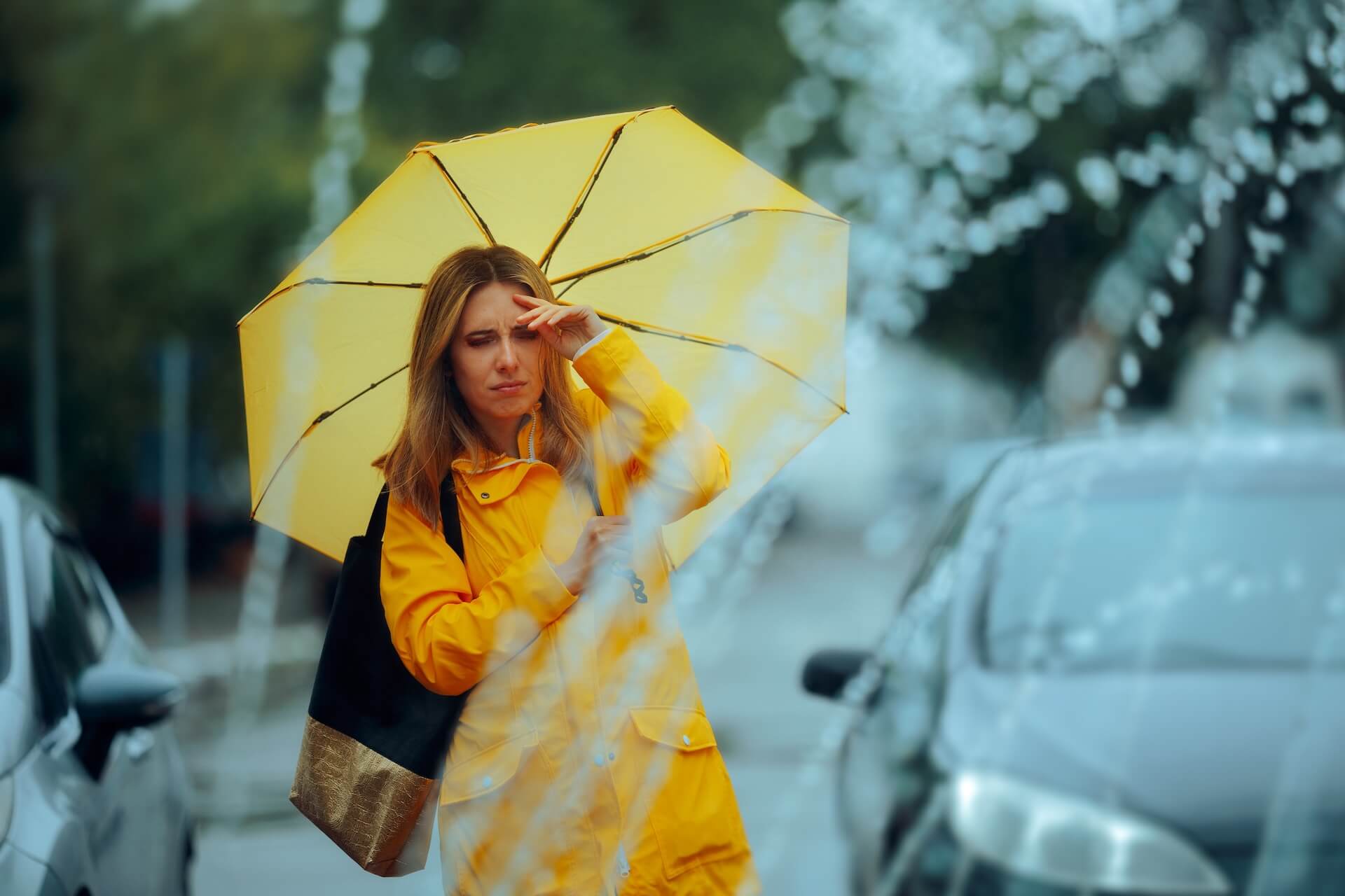 Unhappy Lady Disliking Rain and Bad Weather Conditions. Displeased lady being in a bad mood because of rainy season