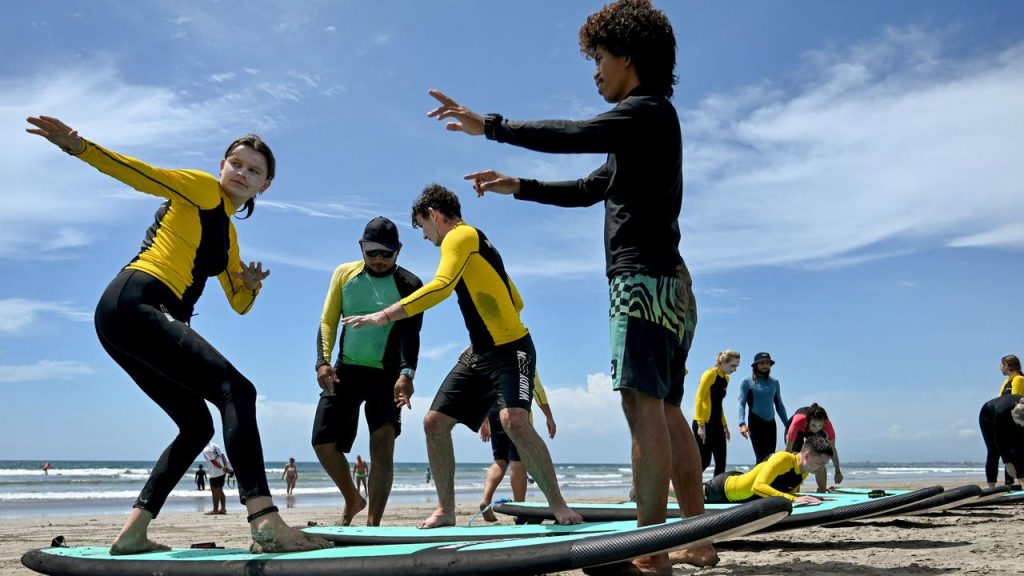 On a surfboard in bali beach