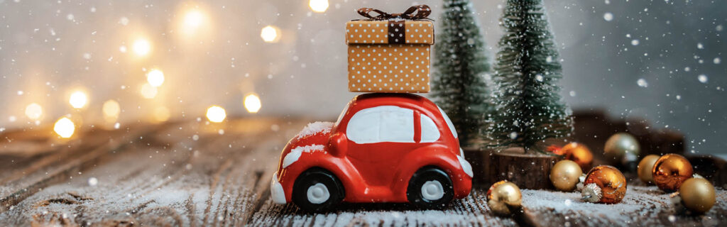 Christmas car decoration carrying gifts
