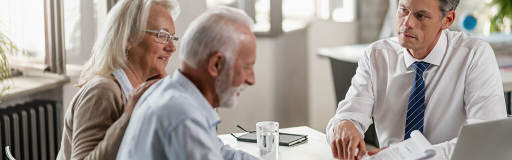 Elderly couple meeting with a financial advisor
