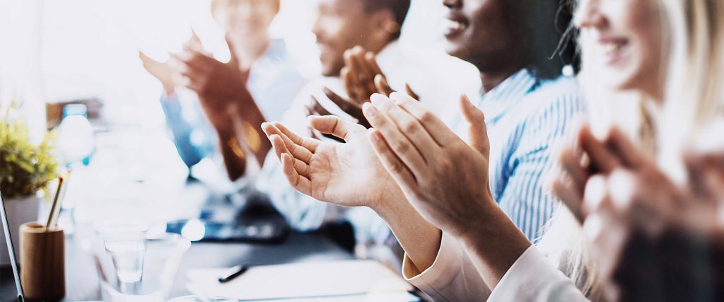 office team applauding