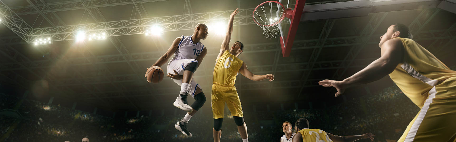 Basketball players competing in a professional arena