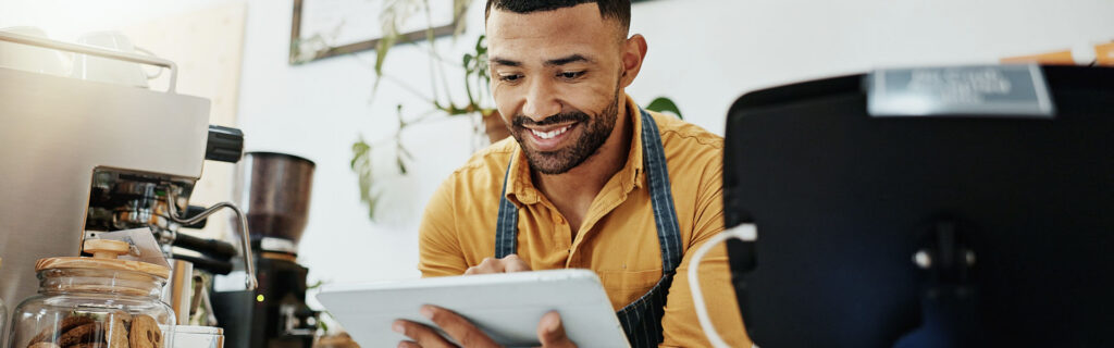 Research collaboration blog with image of man taking a survey while working in a coffee shop