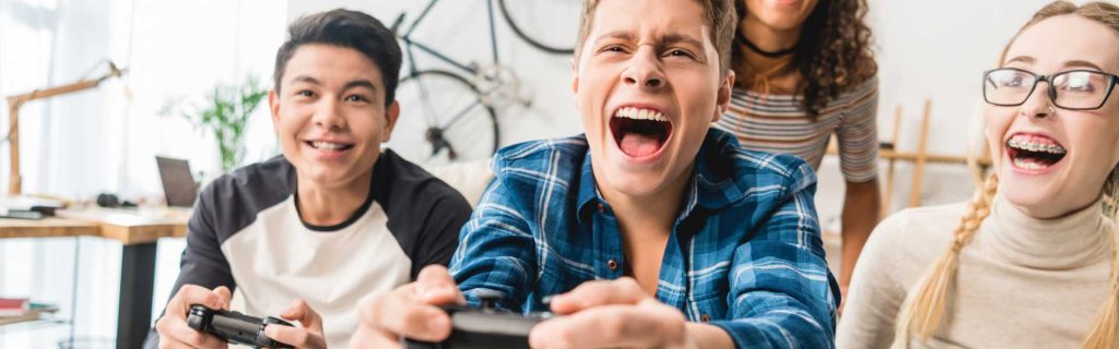 Teens happy playing games