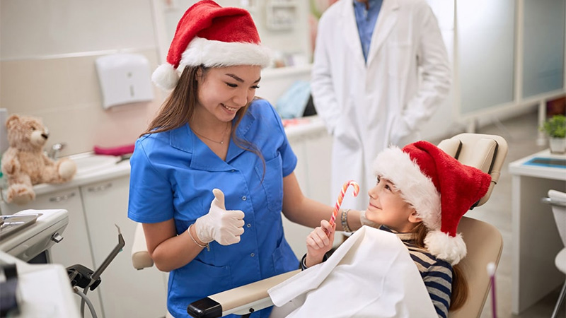 Health professional giving thumbs up to a kid