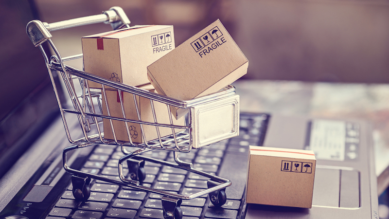 Boxes in a trolley on a laptop keyboard