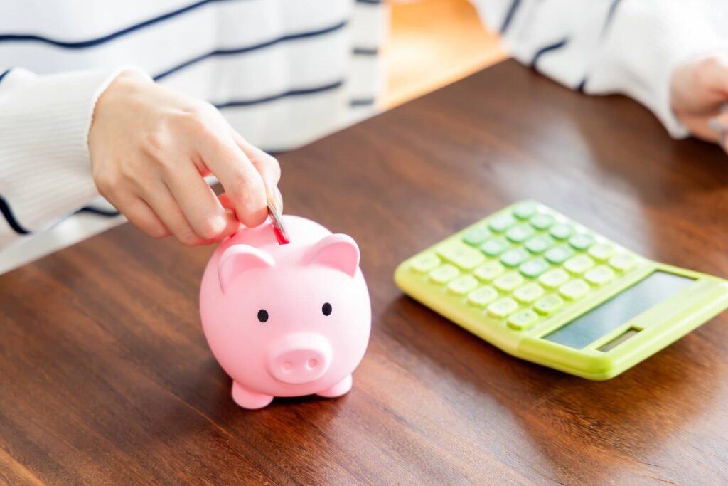 Close-up of a woman saving money