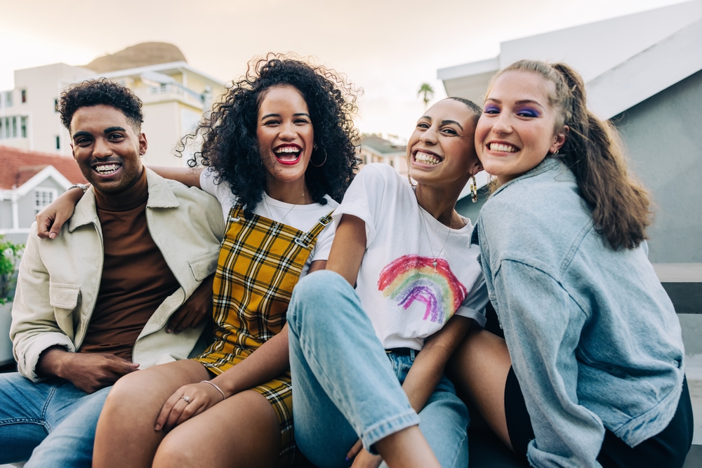 4 friends smiling at the camera