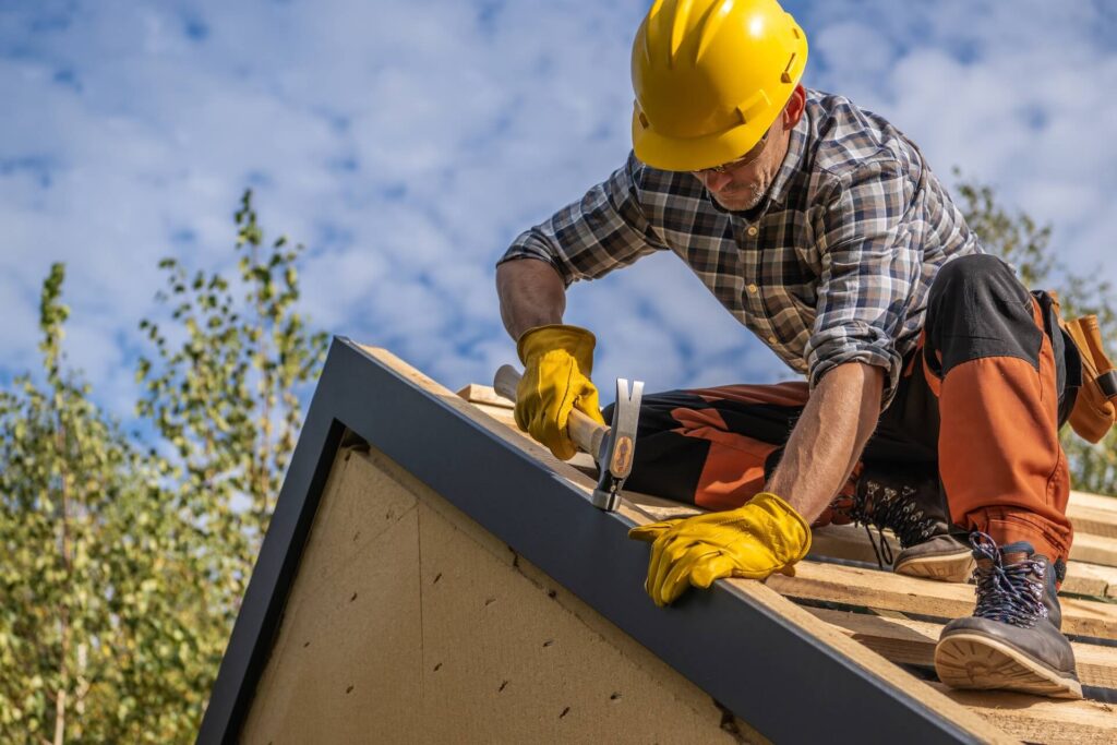 Caucasian Contractor Worker with Drill Driver in His Hand