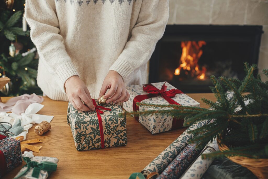 women wrapping Christmas gifts